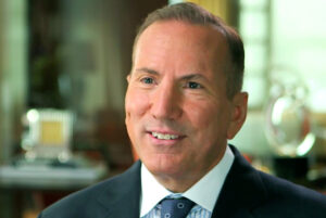The CEO of Greystone real estate smiling for the camera
