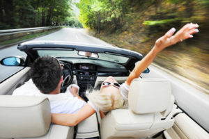 Couple drives car in tv commercial