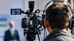 Cameraman monitors audio and video
