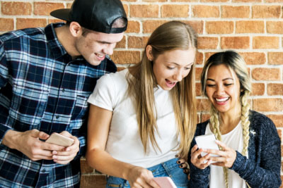 Young adults watch social media videos, ads on phone