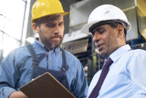 Two men evaluate facility in corporate video