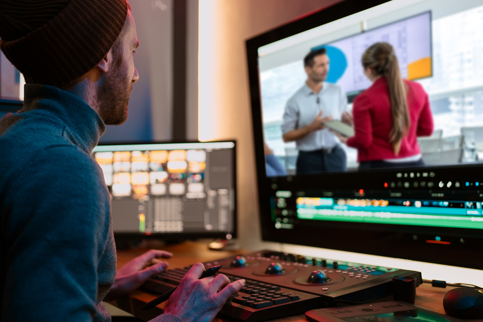 Man works with advanced video editing bay