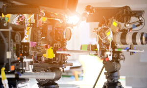 Stock photo of cameras on tripods and sliders