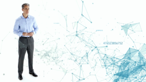 Man stands in front of digital background achieved through using a green screen